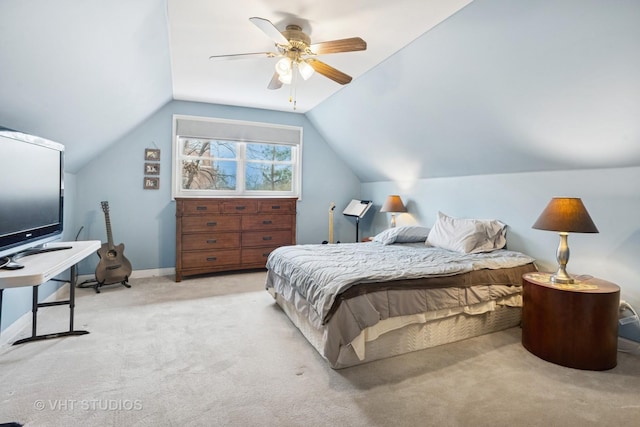 carpeted bedroom with lofted ceiling, ceiling fan, and baseboards