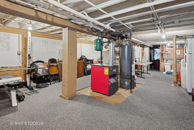 unfinished basement featuring gas water heater and a heating unit