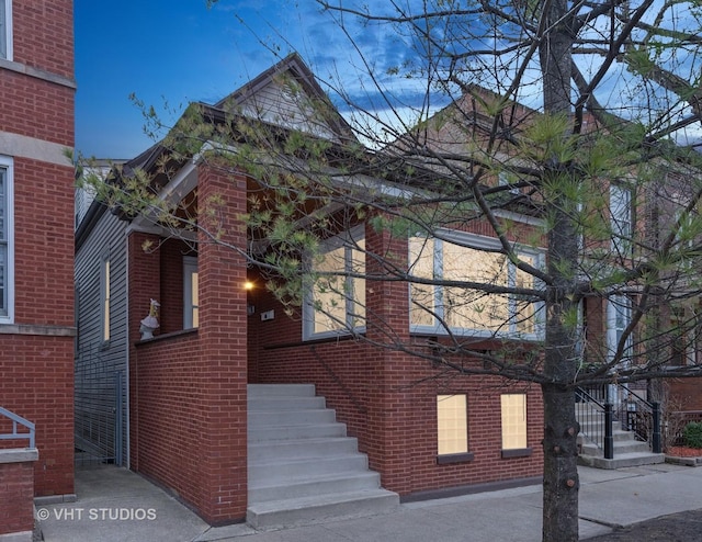 exterior space featuring brick siding