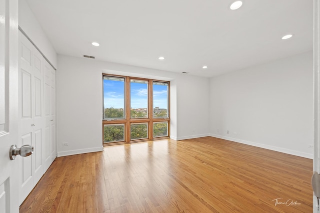 interior space featuring recessed lighting, a closet, visible vents, light wood-type flooring, and baseboards