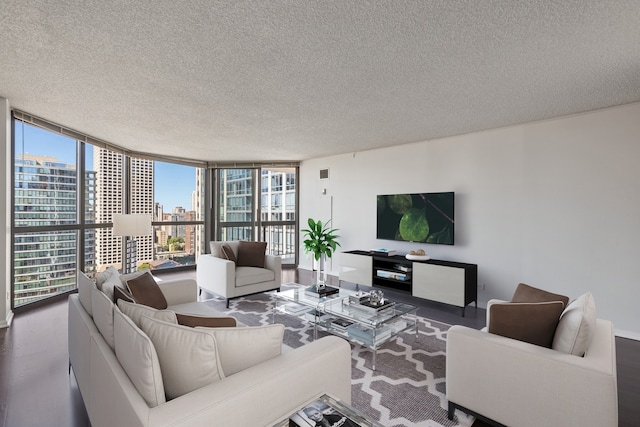 living area featuring a textured ceiling, a wall of windows, and wood finished floors