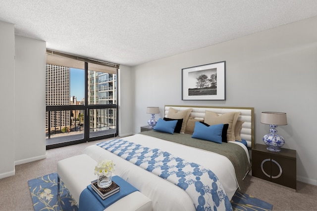 bedroom with floor to ceiling windows, carpet, and baseboards