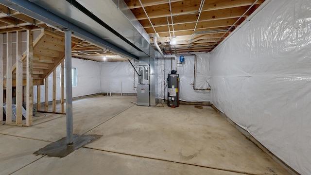 unfinished basement with heating unit and water heater