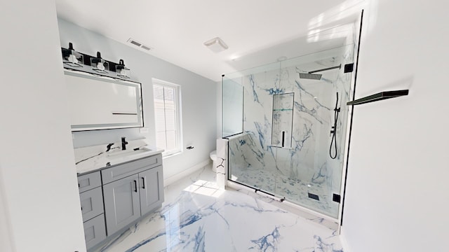 bathroom featuring marble finish floor, a marble finish shower, visible vents, toilet, and vanity