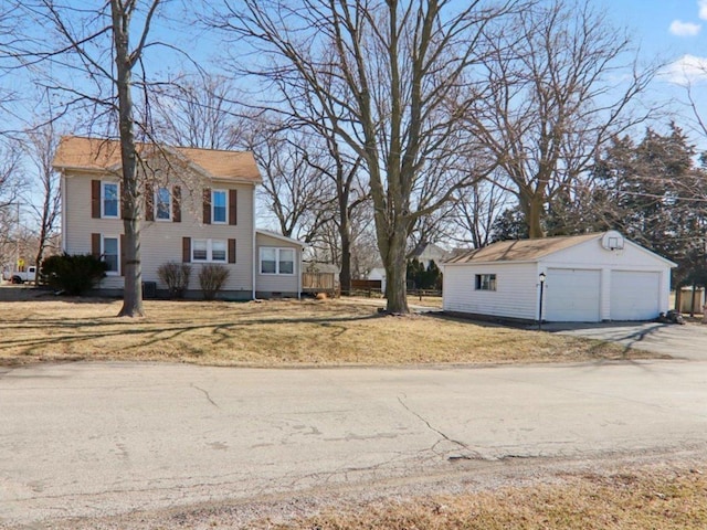 view of yard with a garage and an outdoor structure