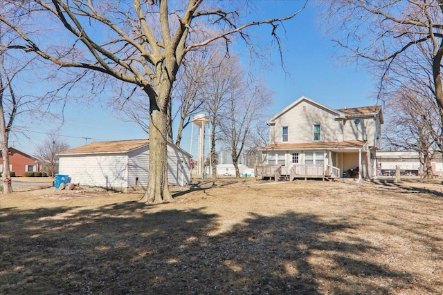 back of house featuring a yard