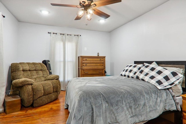 bedroom featuring a ceiling fan and wood finished floors