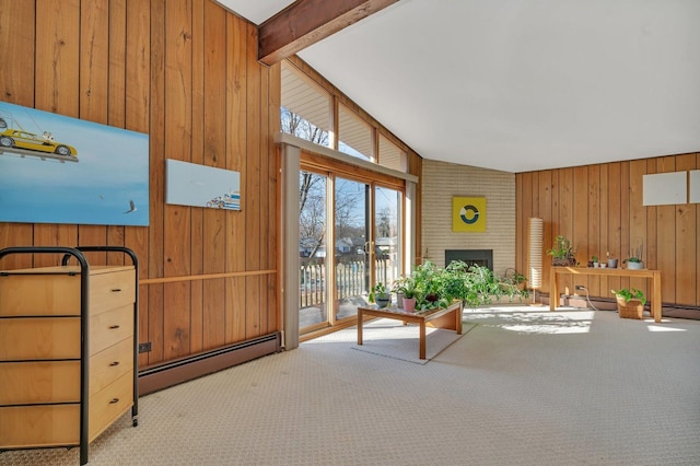 interior space featuring a baseboard heating unit, a fireplace, and vaulted ceiling with beams