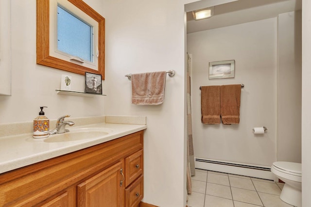 full bathroom featuring curtained shower, toilet, vanity, baseboard heating, and tile patterned floors