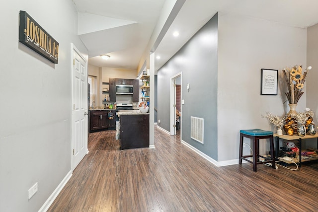 5412 S Wood St, Chicago, IL 60609 - corridor with baseboards, visible vents, and dark wood-type flooring