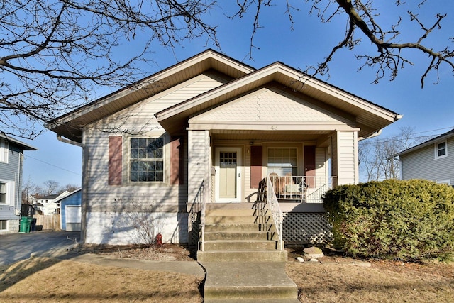 bungalow-style house with a garage and a porch