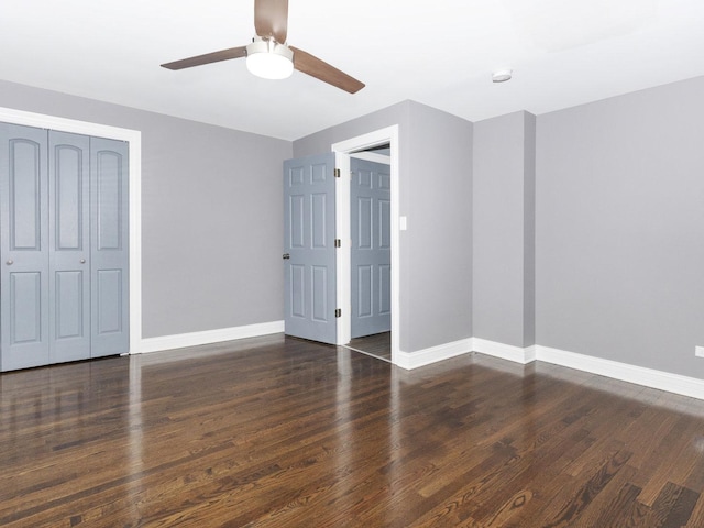 unfurnished bedroom featuring a closet, ceiling fan, baseboards, and wood finished floors