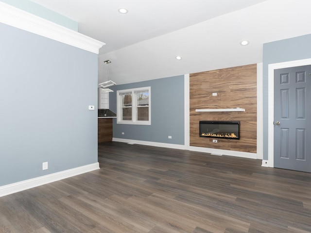 unfurnished living room with recessed lighting, a fireplace, baseboards, and wood finished floors