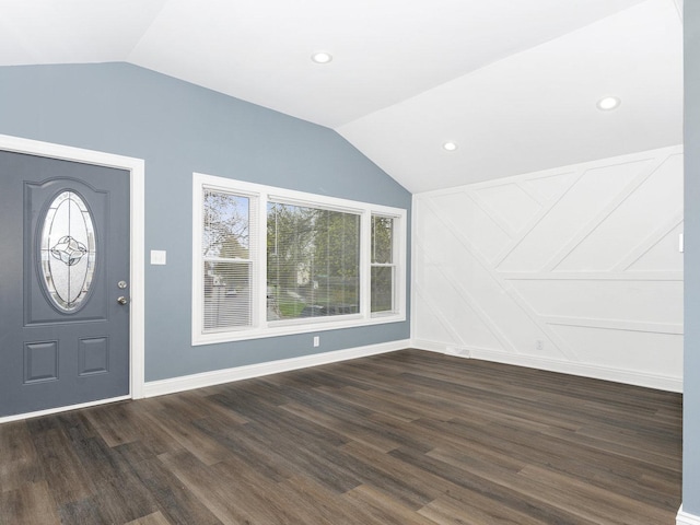 entrance foyer with dark wood-type flooring, recessed lighting, vaulted ceiling, and baseboards