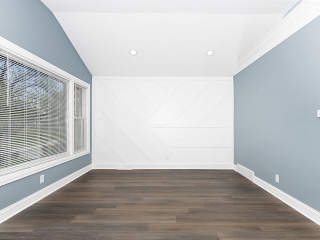 spare room featuring baseboards, wood finished floors, and recessed lighting