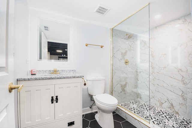 bathroom with a marble finish shower, visible vents, vanity, and toilet