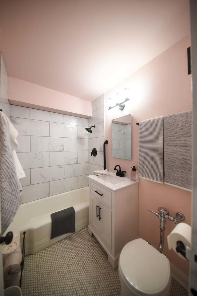 full bath featuring shower / washtub combination, tile patterned flooring, vanity, and toilet