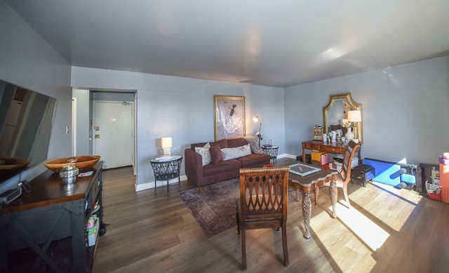 living room featuring baseboards and wood finished floors