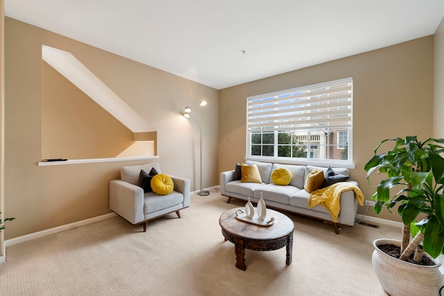 living area featuring carpet, visible vents, and baseboards