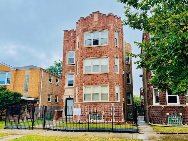 view of building exterior featuring a fenced front yard