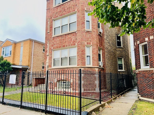 view of building exterior featuring fence