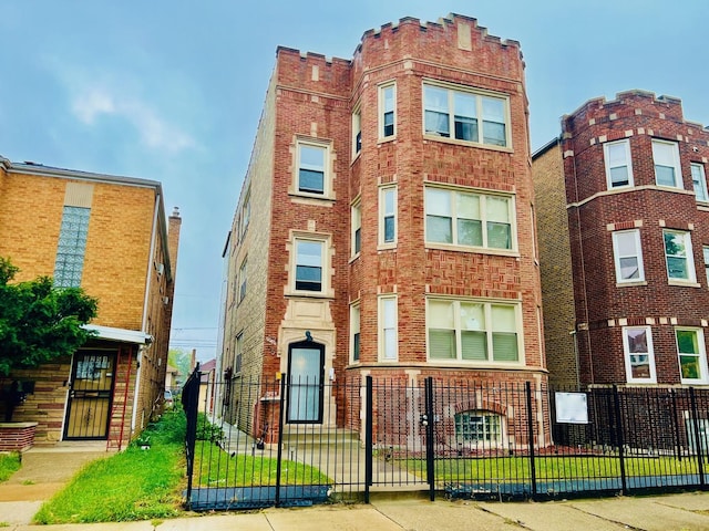 view of building exterior featuring a fenced front yard