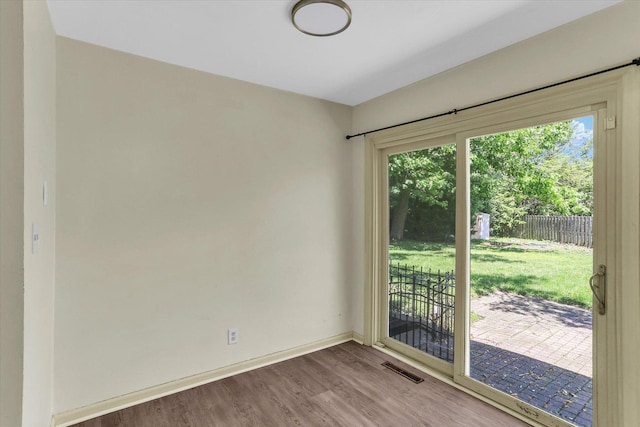 604 Park Lane Dr, Champaign, IL 61820 - empty room featuring wood finished floors and baseboards