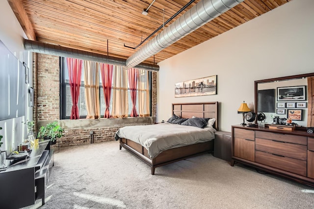 bedroom featuring light carpet, brick wall, and wood ceiling