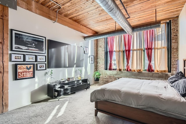 bedroom with wooden ceiling, brick wall, and carpet flooring