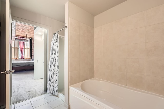 ensuite bathroom with ensuite bathroom, a stall shower, tile patterned flooring, and a tub