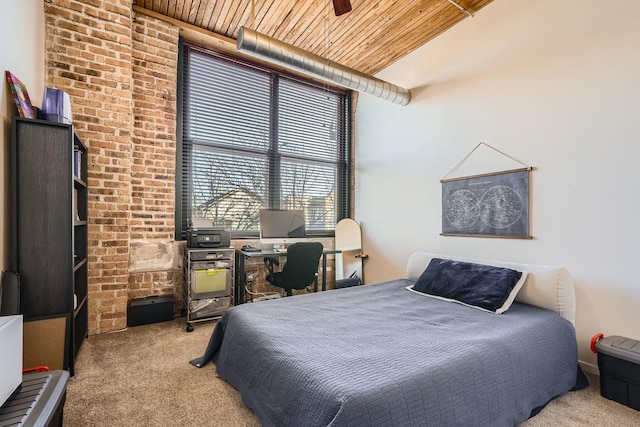 bedroom featuring carpet floors and wood ceiling