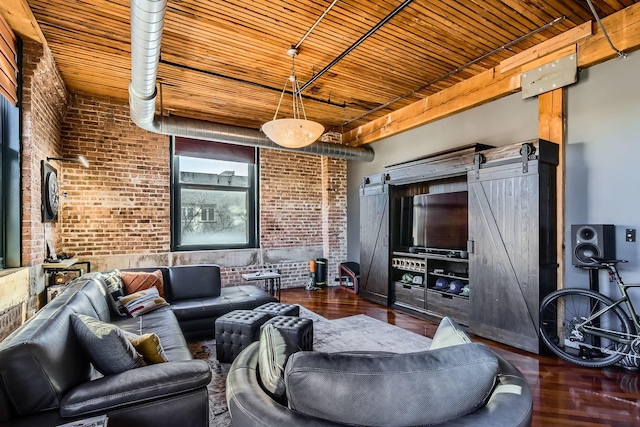 living area with wood finished floors, wood ceiling, brick wall, and a barn door