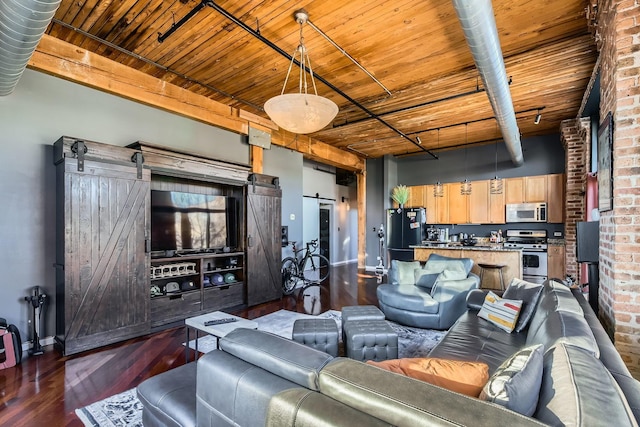 living area with wooden ceiling, a barn door, baseboards, and dark wood-type flooring