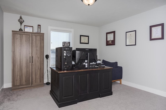 home office with light carpet and baseboards