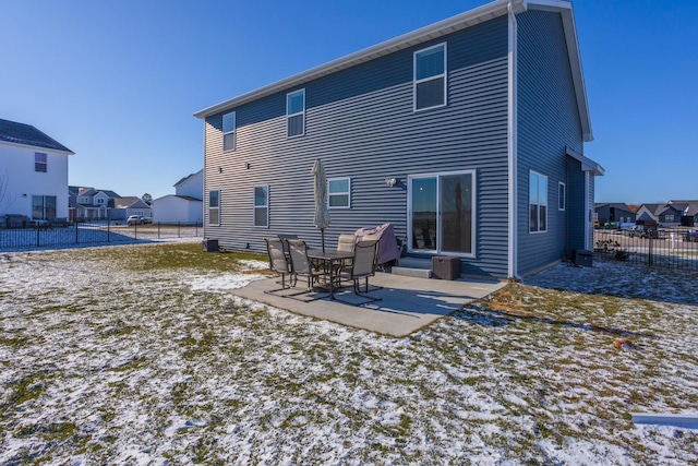 rear view of property with a patio area and fence