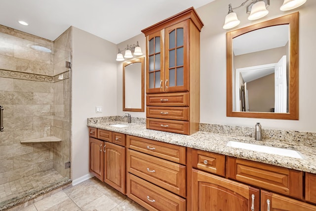 bathroom with double vanity, a sink, and a shower stall