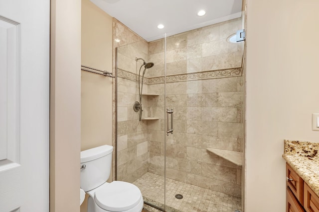 full bath featuring toilet, a shower stall, recessed lighting, and vanity