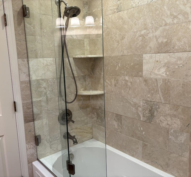 bathroom featuring shower / bath combination with glass door