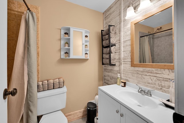 full bathroom featuring curtained shower, vanity, toilet, and wooden walls