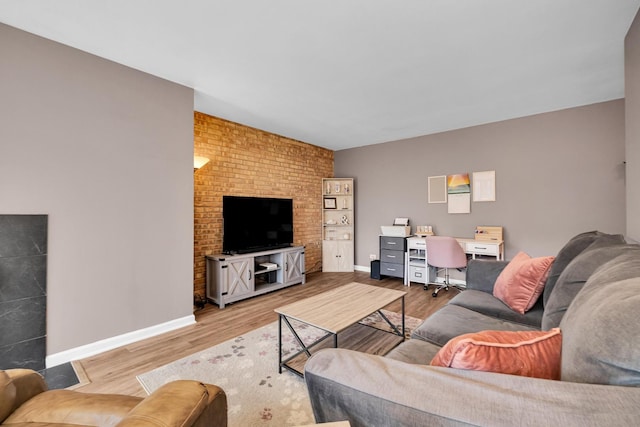 living area with baseboards and light wood-style floors