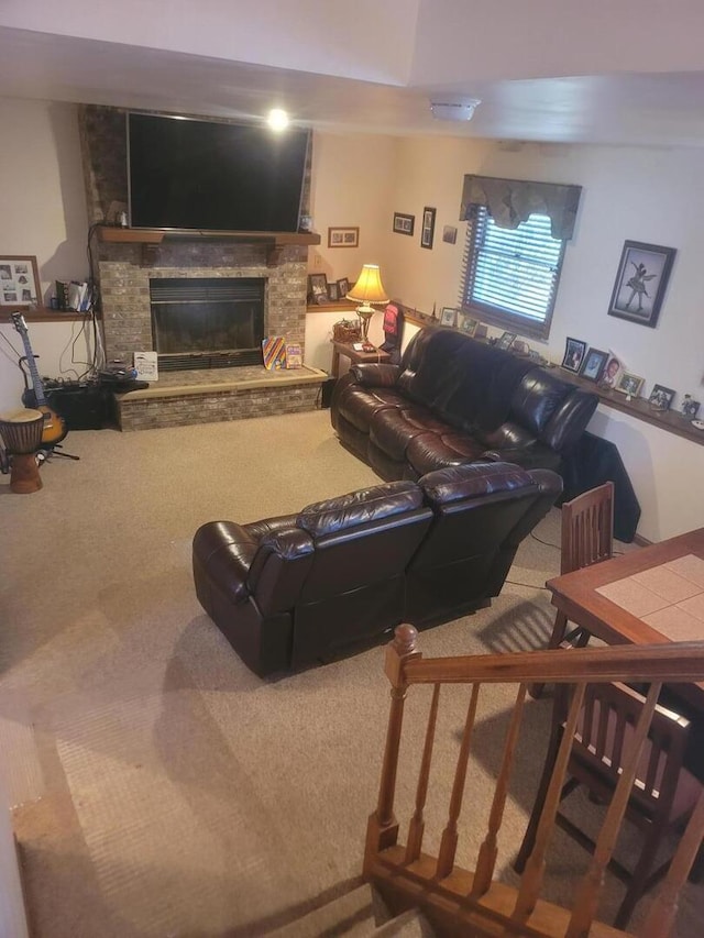 carpeted living room featuring a stone fireplace