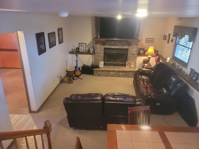 carpeted living area with a stone fireplace, tile patterned flooring, and baseboards