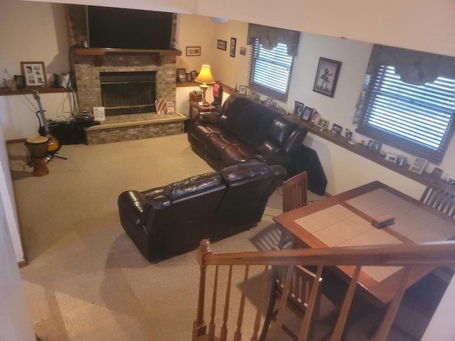 living area with carpet floors and a fireplace