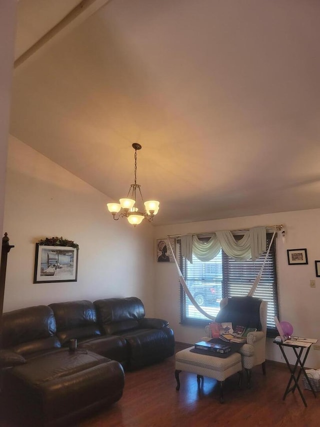 living area featuring a notable chandelier and wood finished floors