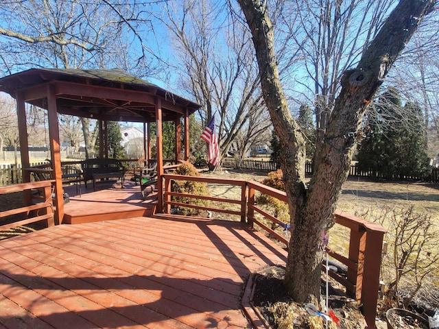 deck featuring fence and a gazebo