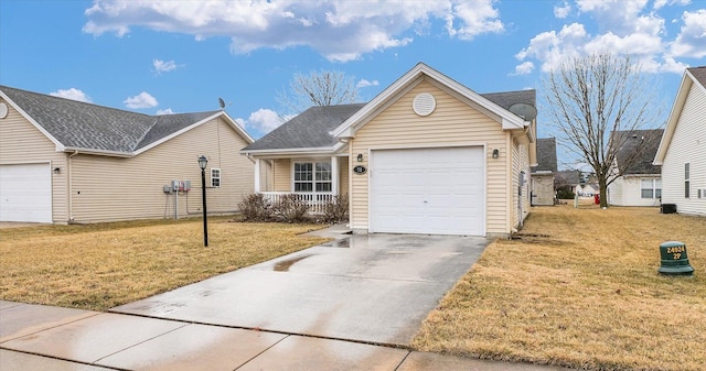 ranch-style home featuring a front lawn, an attached garage, and concrete driveway