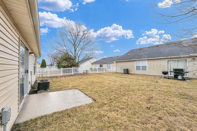 view of yard featuring a patio, central AC, and a fenced backyard