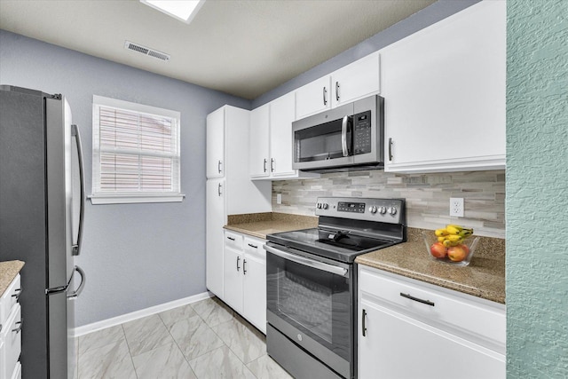 kitchen with visible vents, marble finish floor, tasteful backsplash, stainless steel appliances, and baseboards