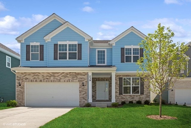 craftsman house with driveway, brick siding, a garage, and a front yard