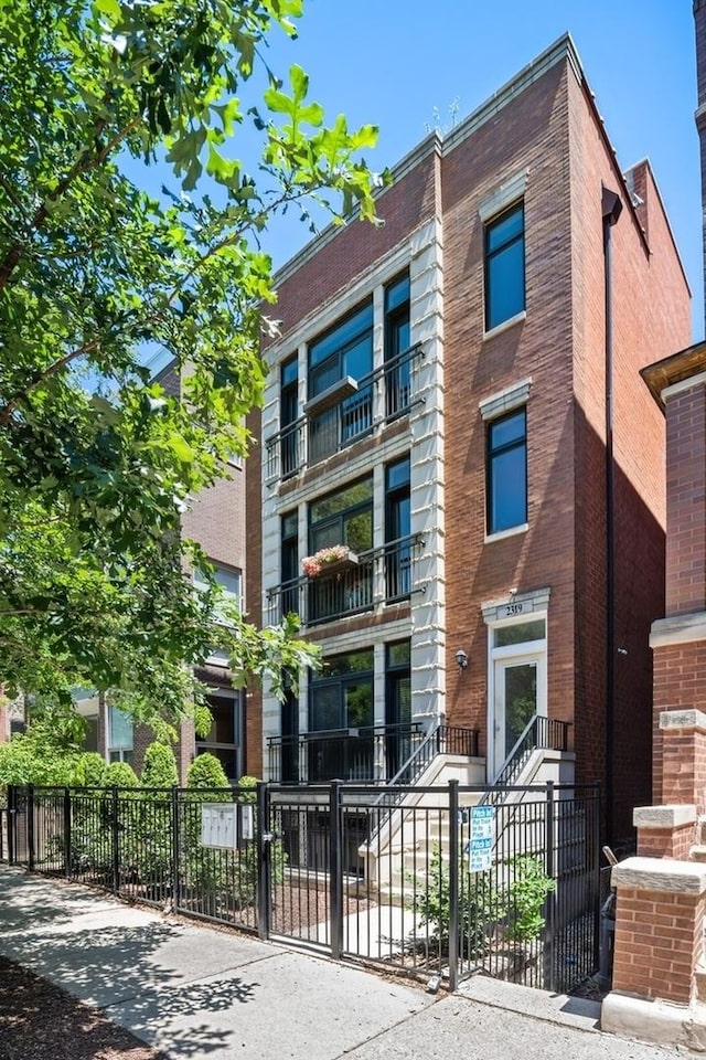 view of property featuring a fenced front yard